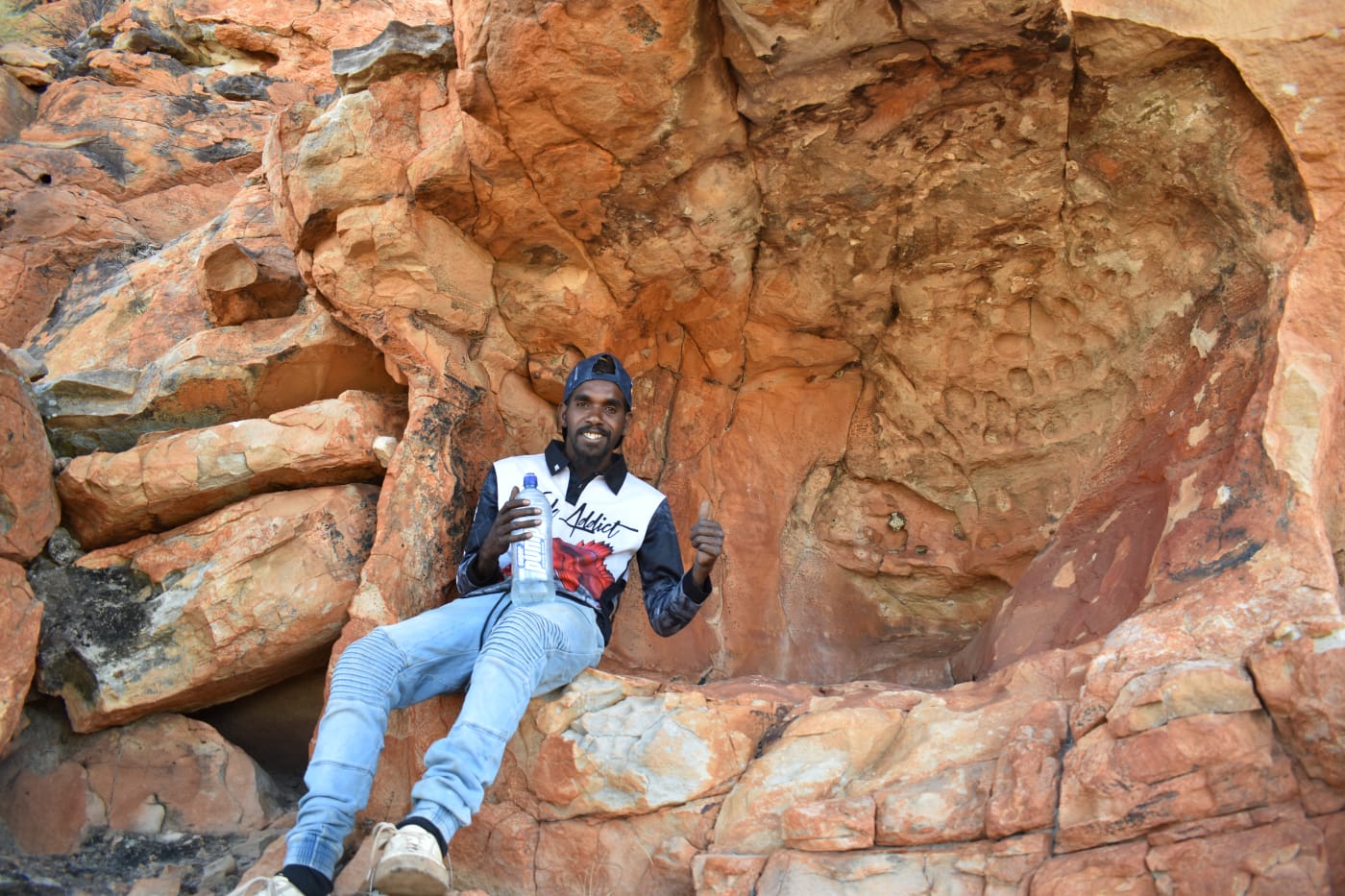 Warru Ranger Zachariah Westlake during wiliji camera retrieval on the Grant Range, Jarlmadangah Burru, West Kimberley region, WA.