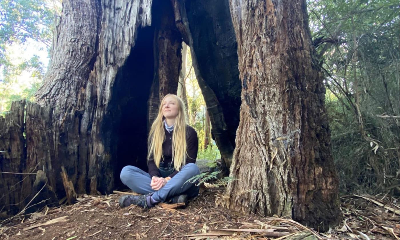 Dr Kita Ashman sitting under a tree