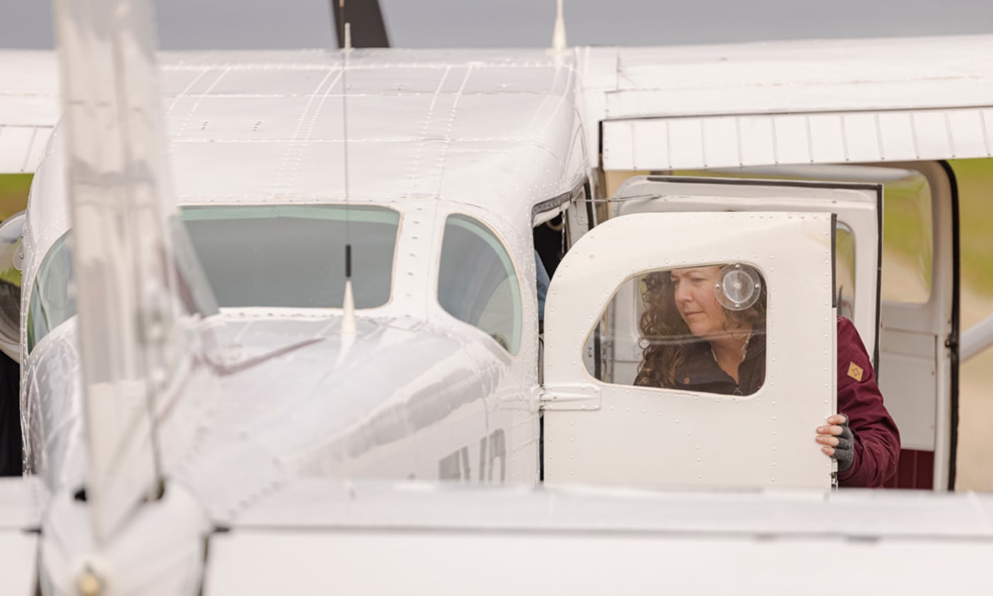 Dr Liberty Olds, Conservation Manager, Zoos SA unloading cargo from charter plane