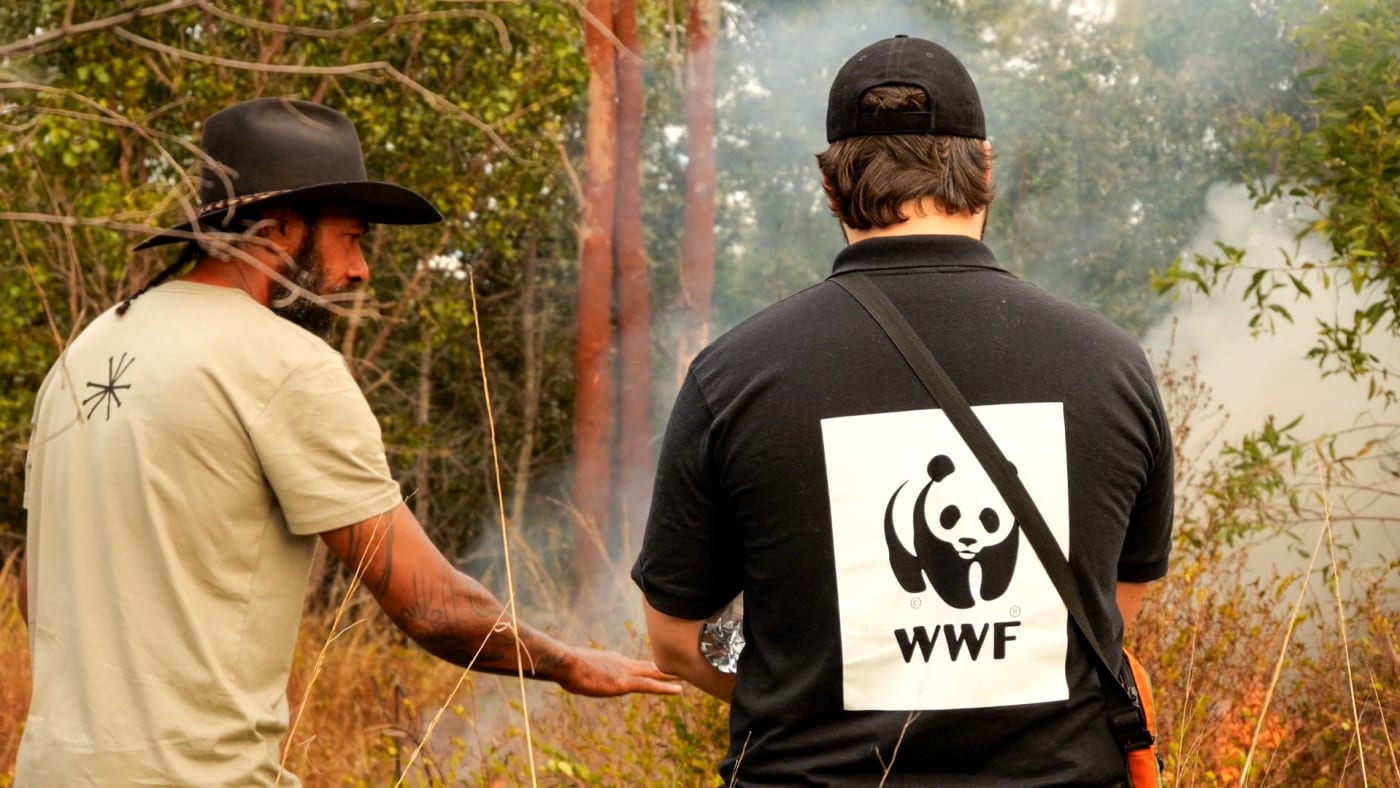 Leeton Lee, Firesticks Southeast Queensland Lead Fire Practitioner on Jervoise Station explaining a cultural burn to Djarra Delaney, Indigenous Land Management Specialist, WWF-Australia