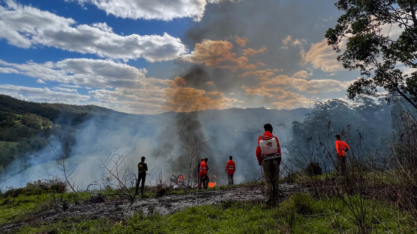 Githabul Rangers extinguishing Cultural Burn on Githabul Country