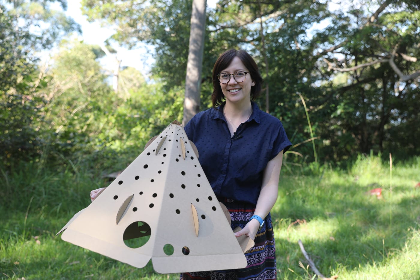 Dr Carthey with a habitat pod