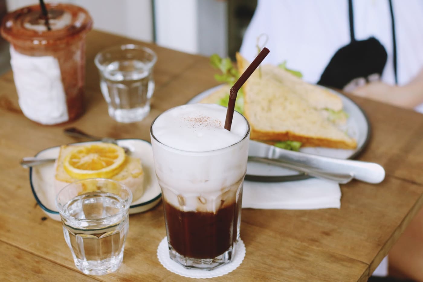 Iced coffee with plastic straw