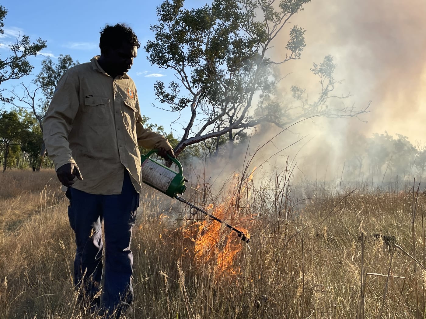 Uunguu Ranger Damon Bundamurra conducting ground burning using a drip torch on Wunambal Gaambera Country