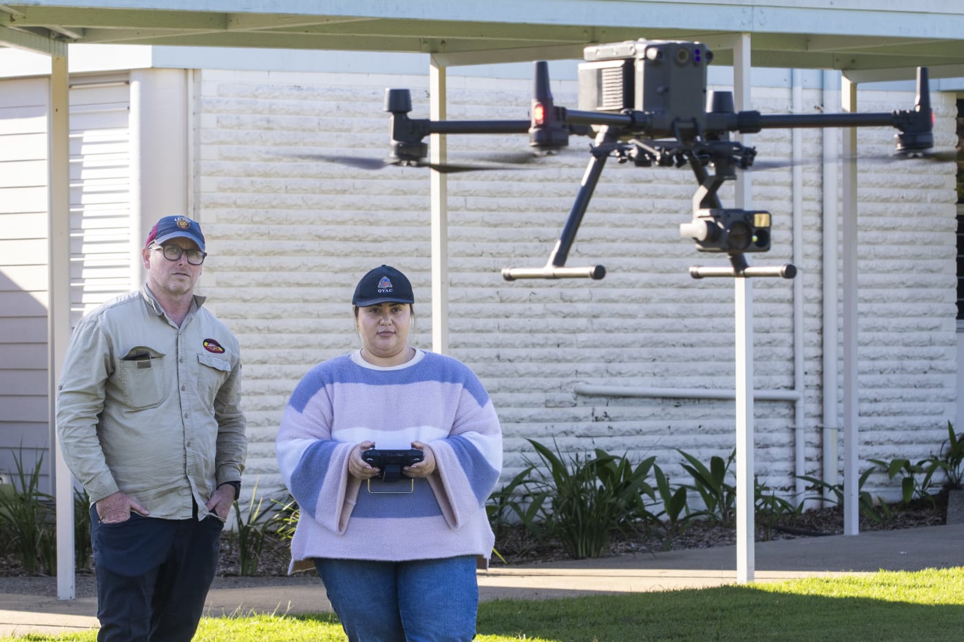 Quandamooka Yoolooburrabee Aboriginal Corporation (QYAC)'s Kiah Morgan operating drone during koala survey on Stradbroke Island in collaboration with Dan Carter from QYAC