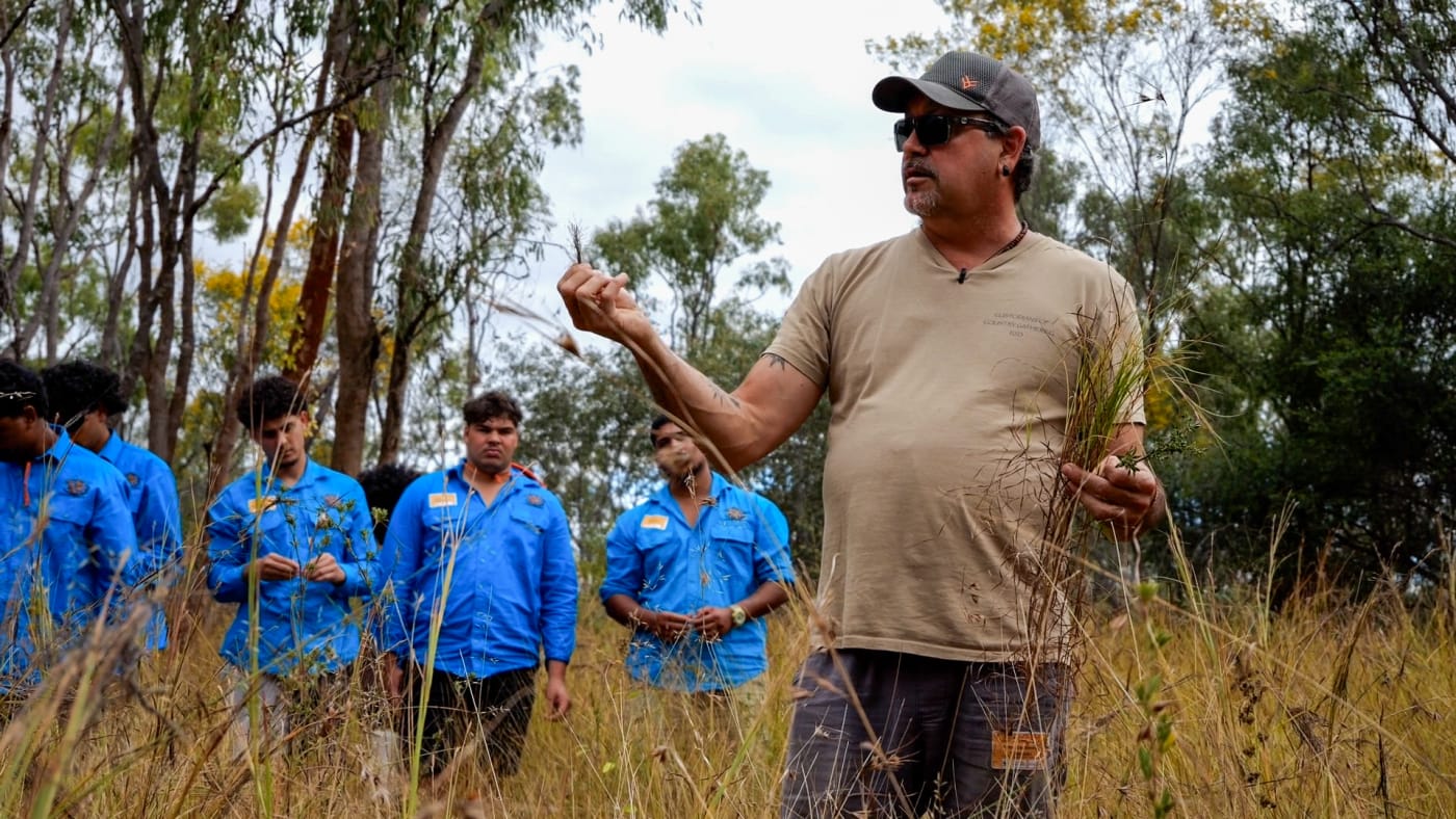Young Gudjuda rangers listening to Firesticks Alliance co-founder and cultural burning expert Victor Steffensen on Jervoise Station.