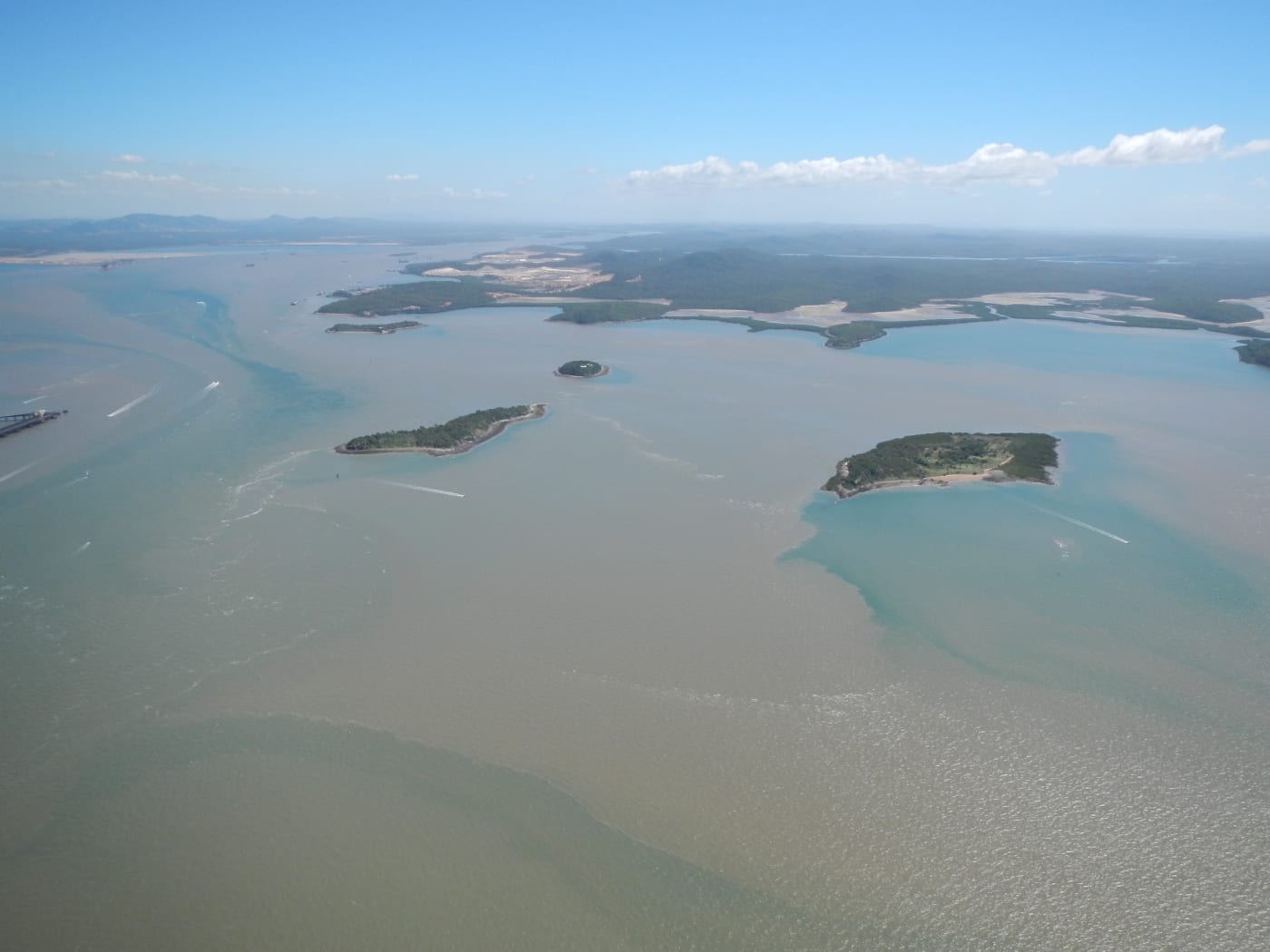 Sediment plumes from dredging associated with the further development of the harbour. Gladstone Harbour, Queensland