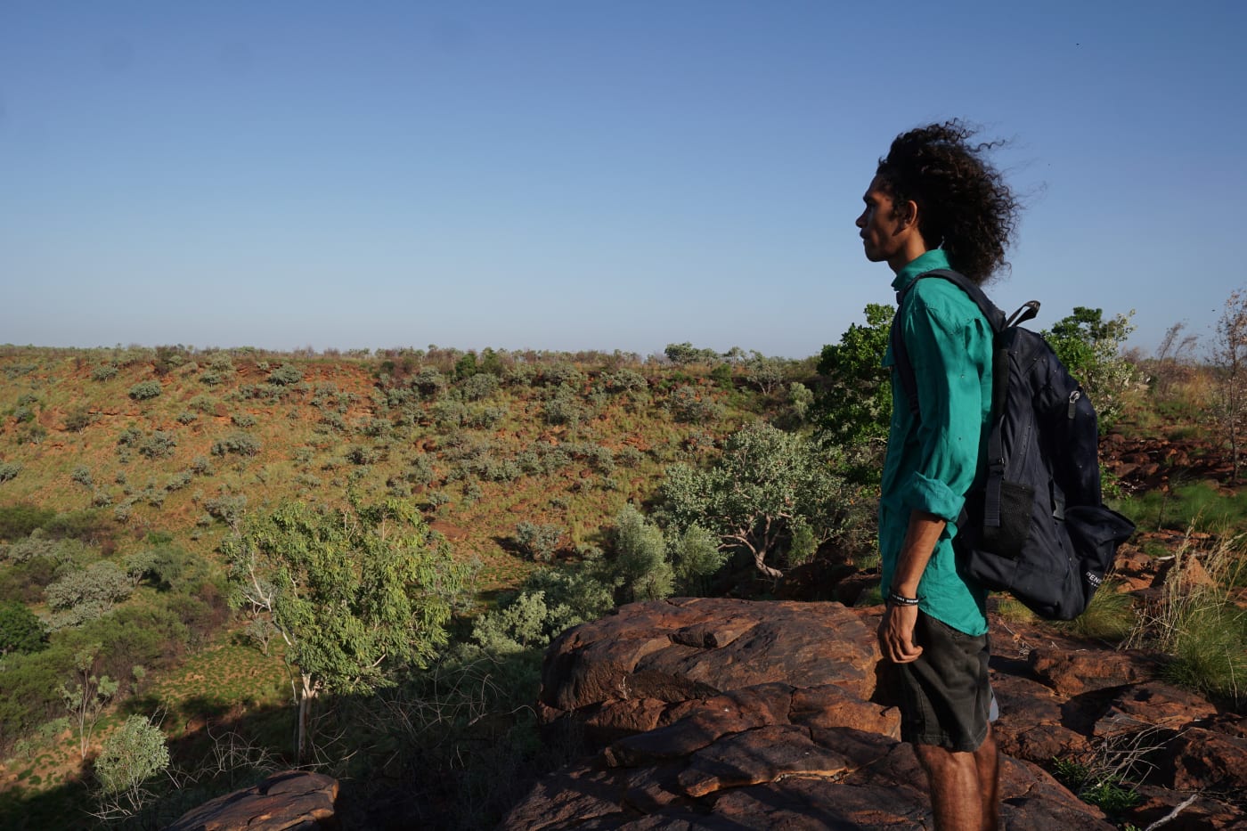 Lane Broome, Nyikina Mangala Ranger looking out from top of hill at Erskine Range (Malarabba) in the West Kimberley Region.