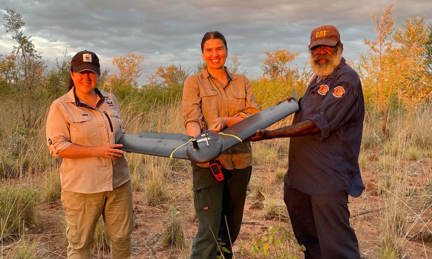 Holding the fixed-wing drone used for wiliji surveys on Nyikina Mangala Country