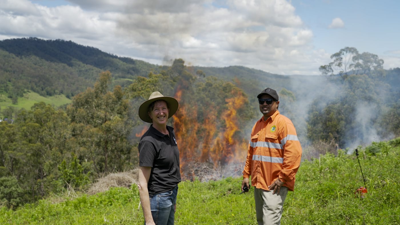 WWF-Australia's Tanya Pritchard (left) and Githabul Ranger Coordinator Charlie Ord (right)  Supervising Cultural Burn