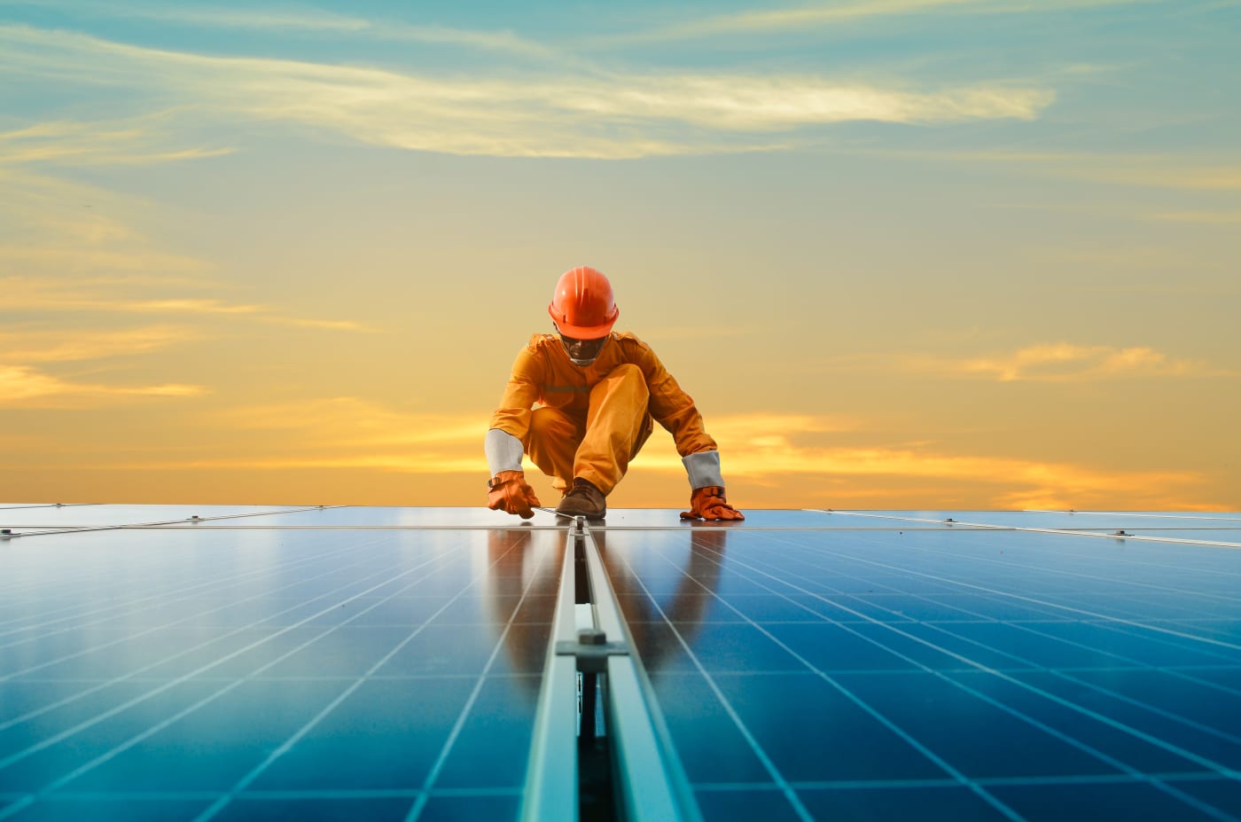 Worker working on solar panels.