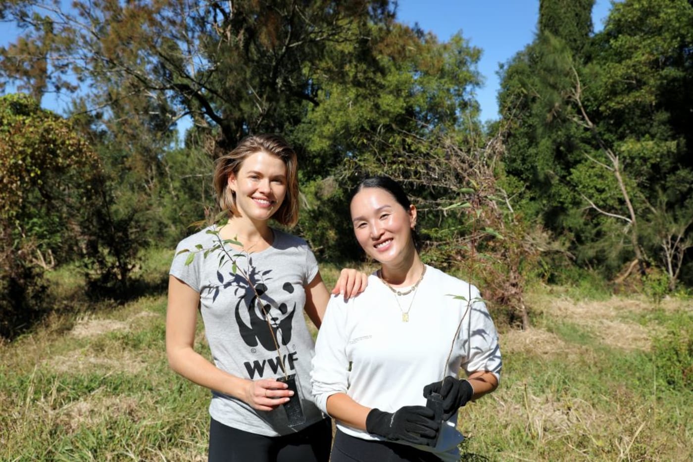 Nicole Warne and Victoria Lee spent the day helping Bangalow Koalas plant koala habitat trees
