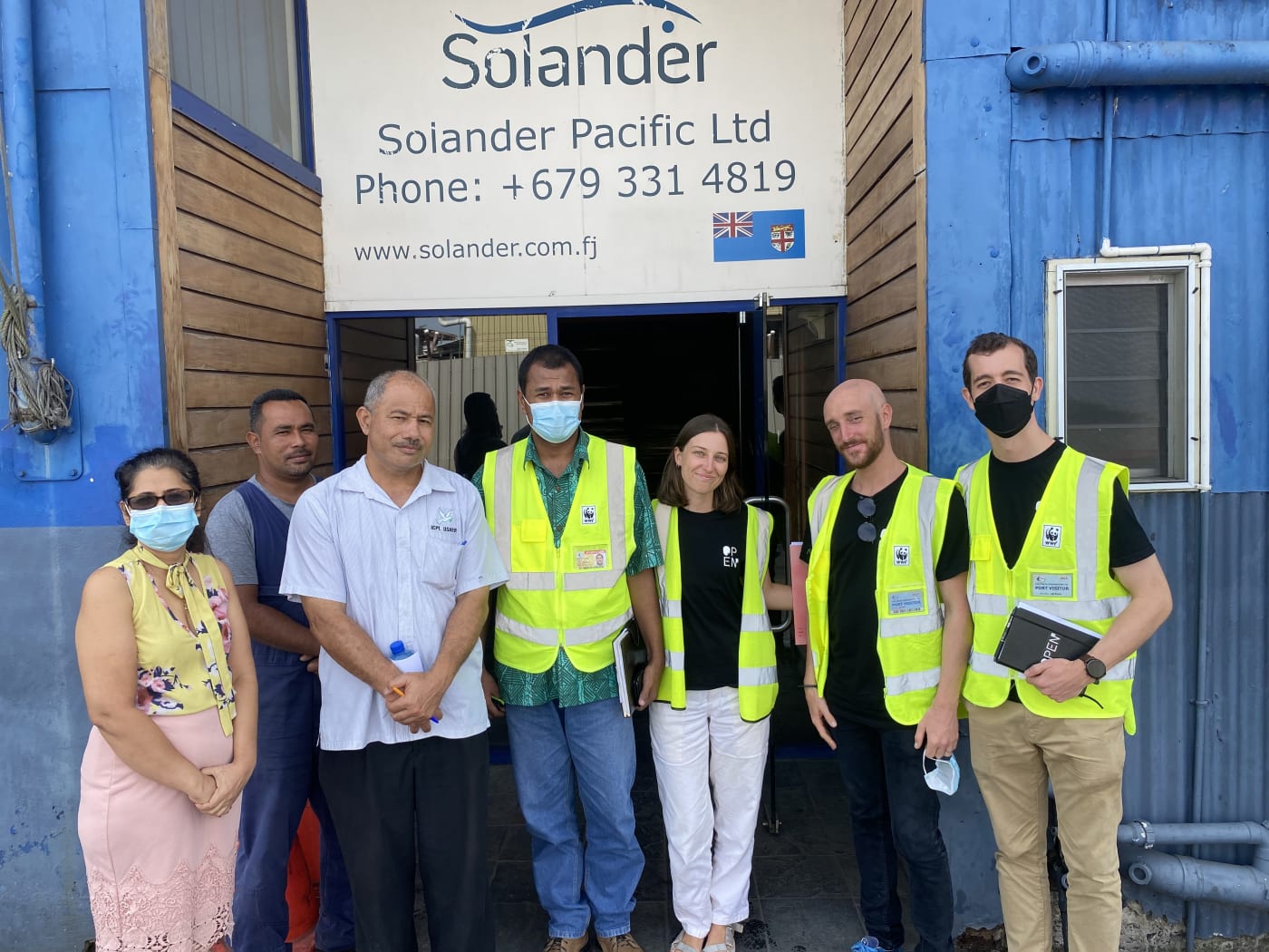 Solander Pacific, WWF Pacific and OpenSC team members outside the Solander Office at the Suva port. Left to right: Radhika Kumar (Solander), Solomone Rokotuiveikau (Solander), Joe Peters (Solander), Adriu Iene (WWF Pac), Lily Lunday (OpenSC), Pierre Wittorski (OpenSC), Tim Baker (OpenSC).
