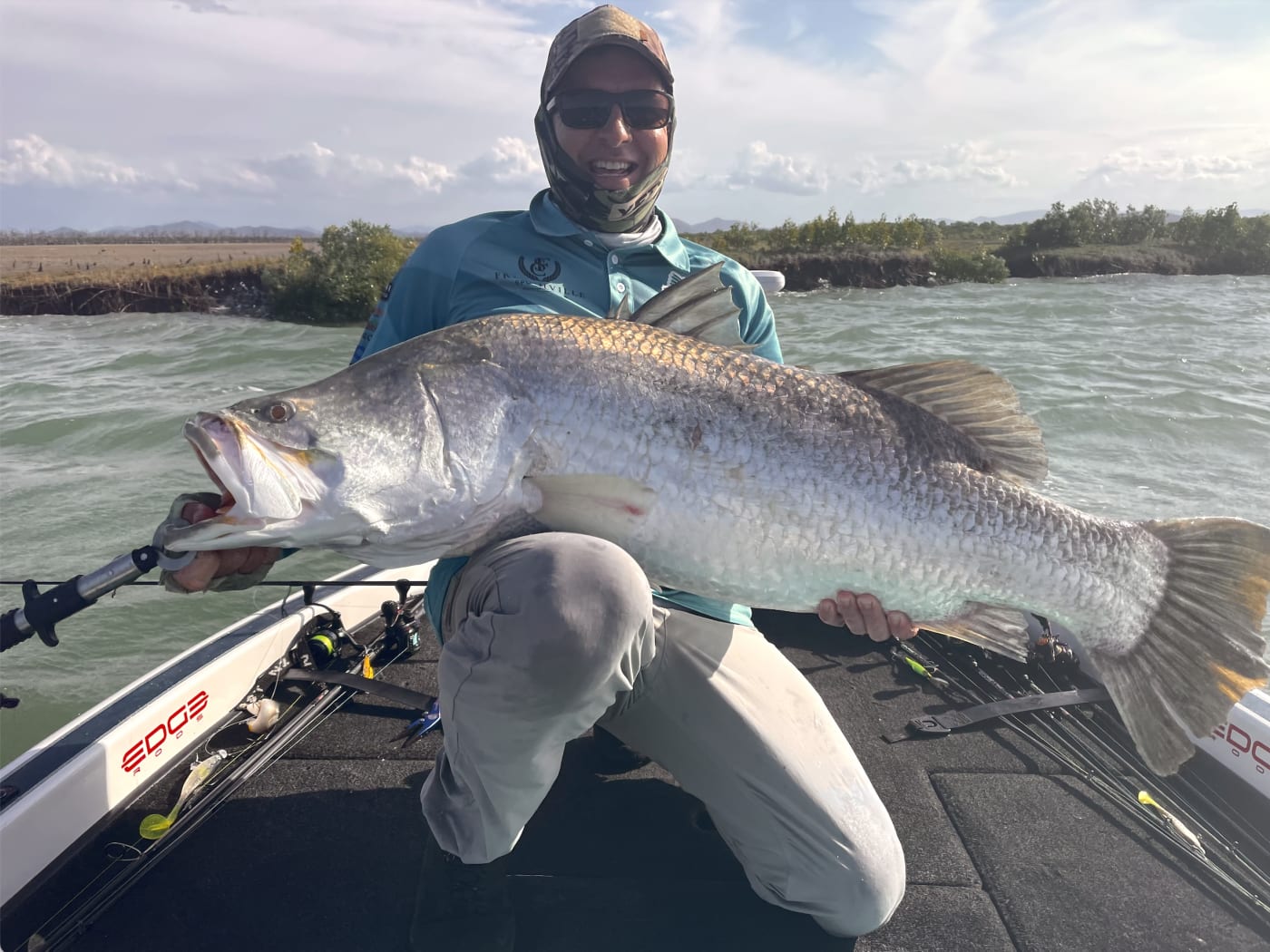 Recreational fisher Stephen Purnell holding up a barramundi in Rockhamption