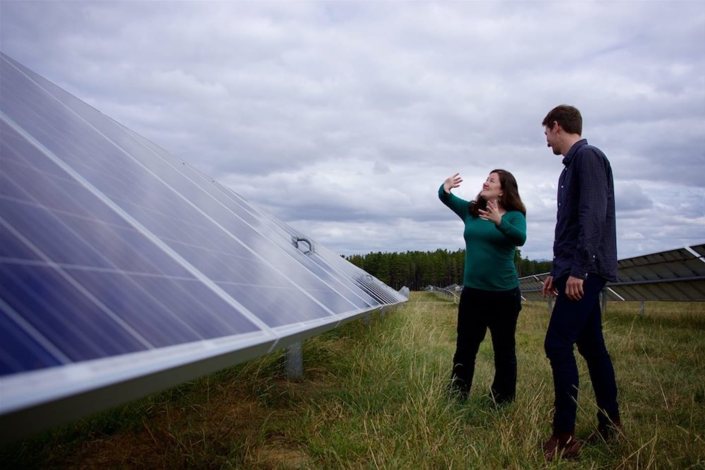 Nicky Ison= WWF-Australia Energy Transition Manager next to a solar panel