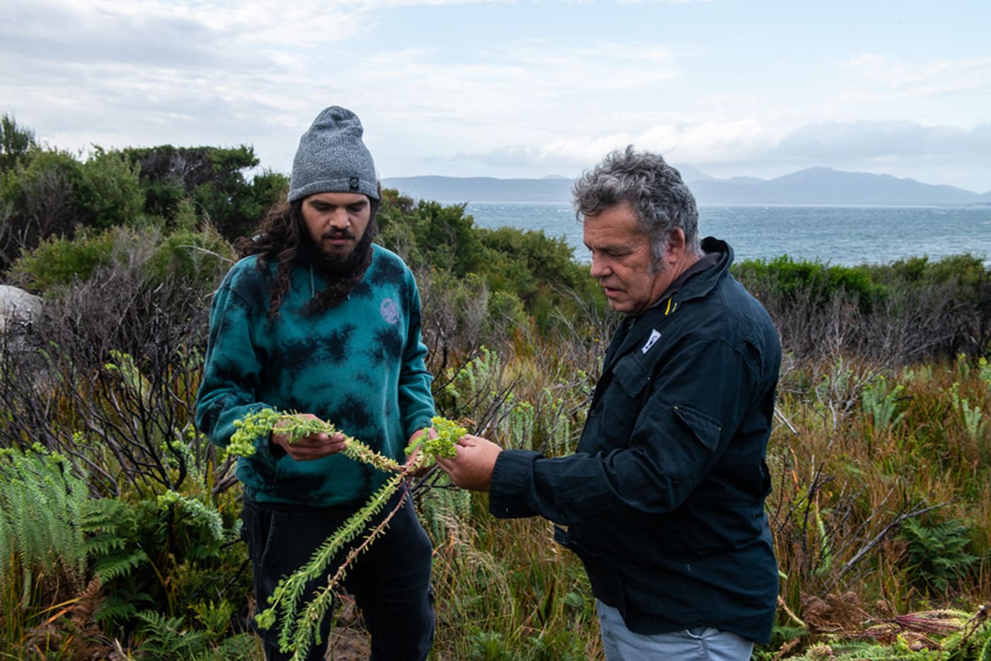 Pakana Ranger Baden Maynard and WWF-Australia’s Darren Grover examining invasive species on lungtalanana