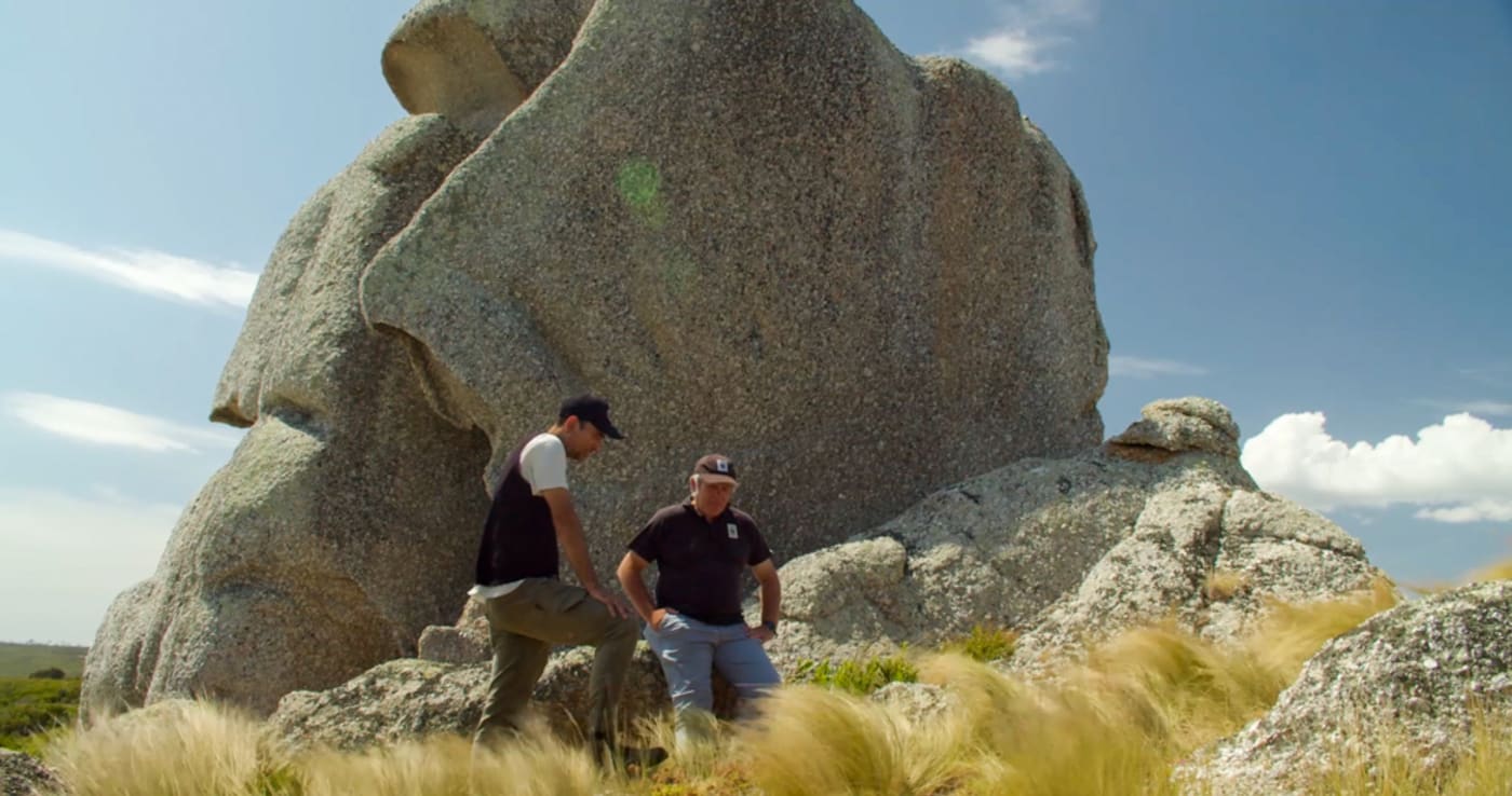 Tasmanian Aboriginal Centre’s Andry Sculthorpe and WWF-Australia’s Darren Grover exploring significant rock formations on lungtalanana