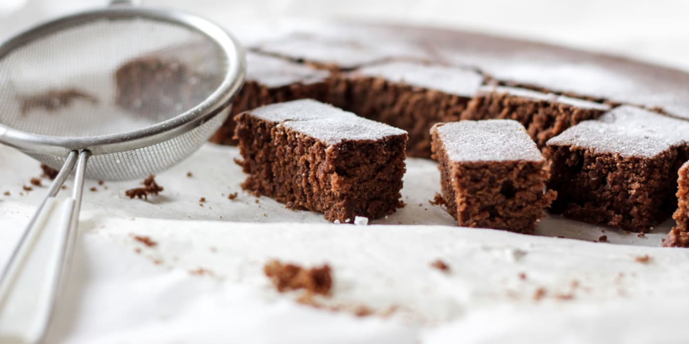 Brownies on baking paper. Photo by NordWood Themes on Unsplash