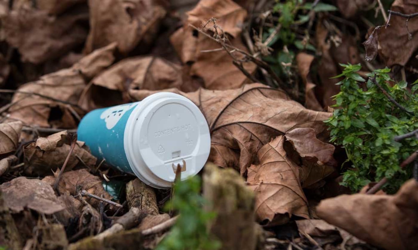 Discarded disposable coffee cups litter the streets