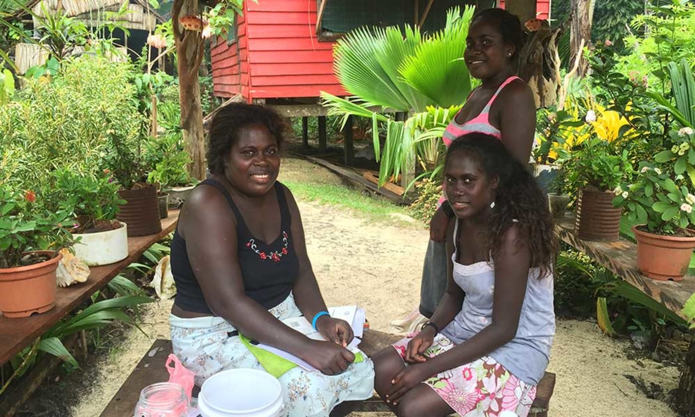 Hellen Maikia and daughters at her smallgoods shop in Simboro village, Gizo