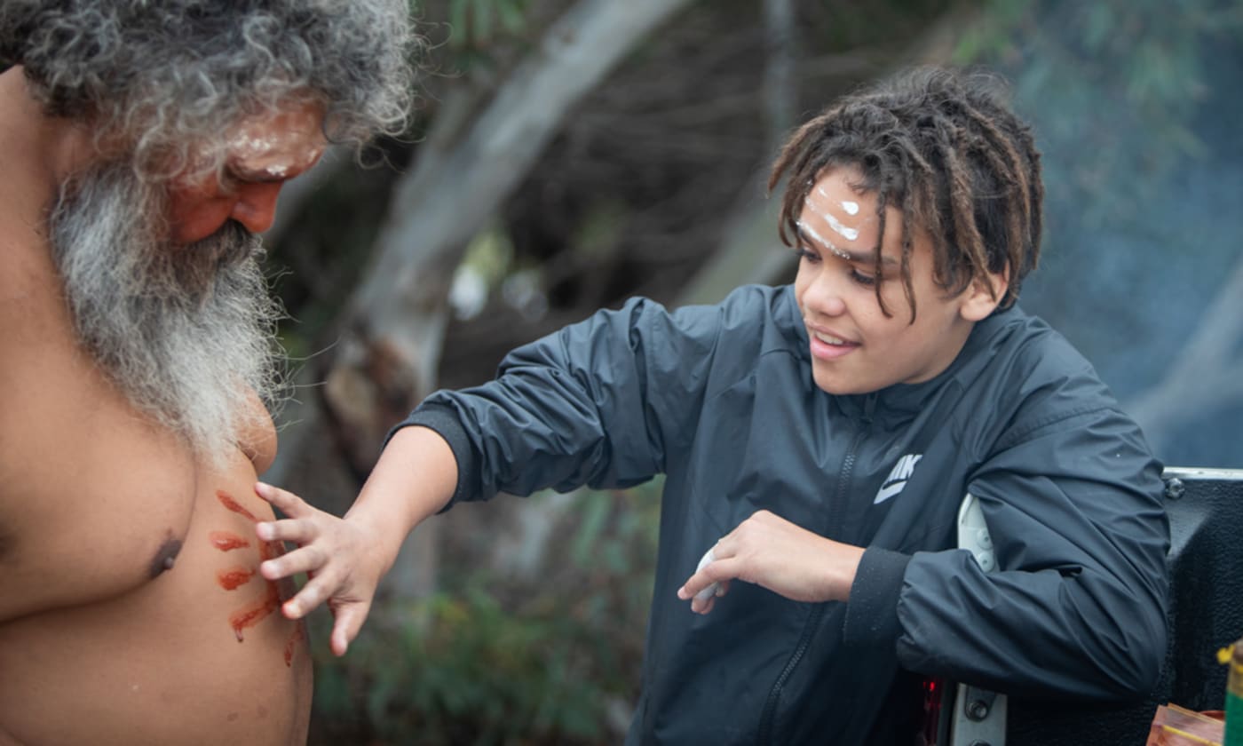 Adjahdura/Narungga and Ngadjuri Elder Quentin Aegis and his grandson performing a smoking ceremony to mark the bettong release at Dhilba Guuranda-Innes National Park