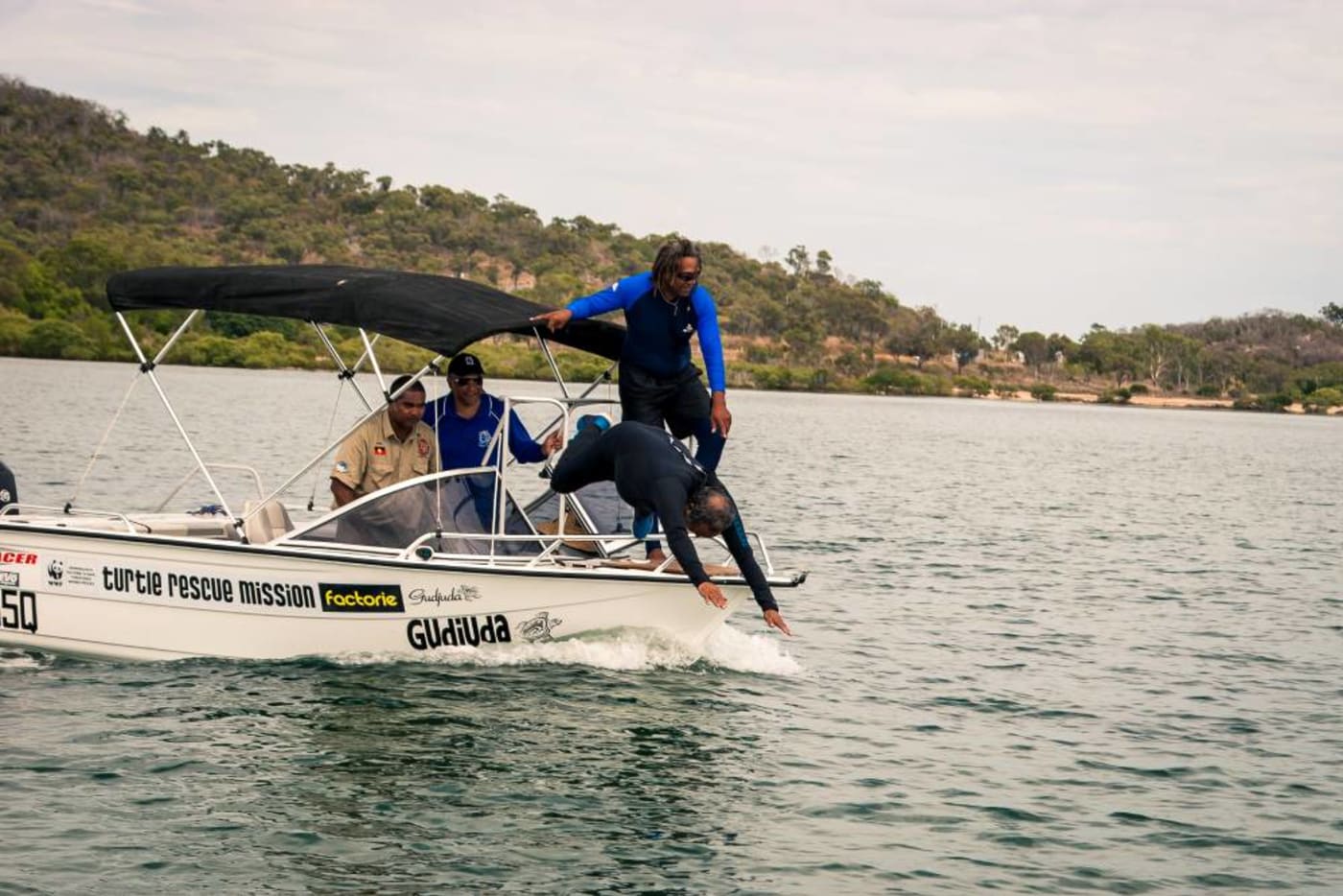 Girringun and Gudjuga Rangers catching turtles at the Traditional Owners Turtle Training Camp in Bowen= Queensland