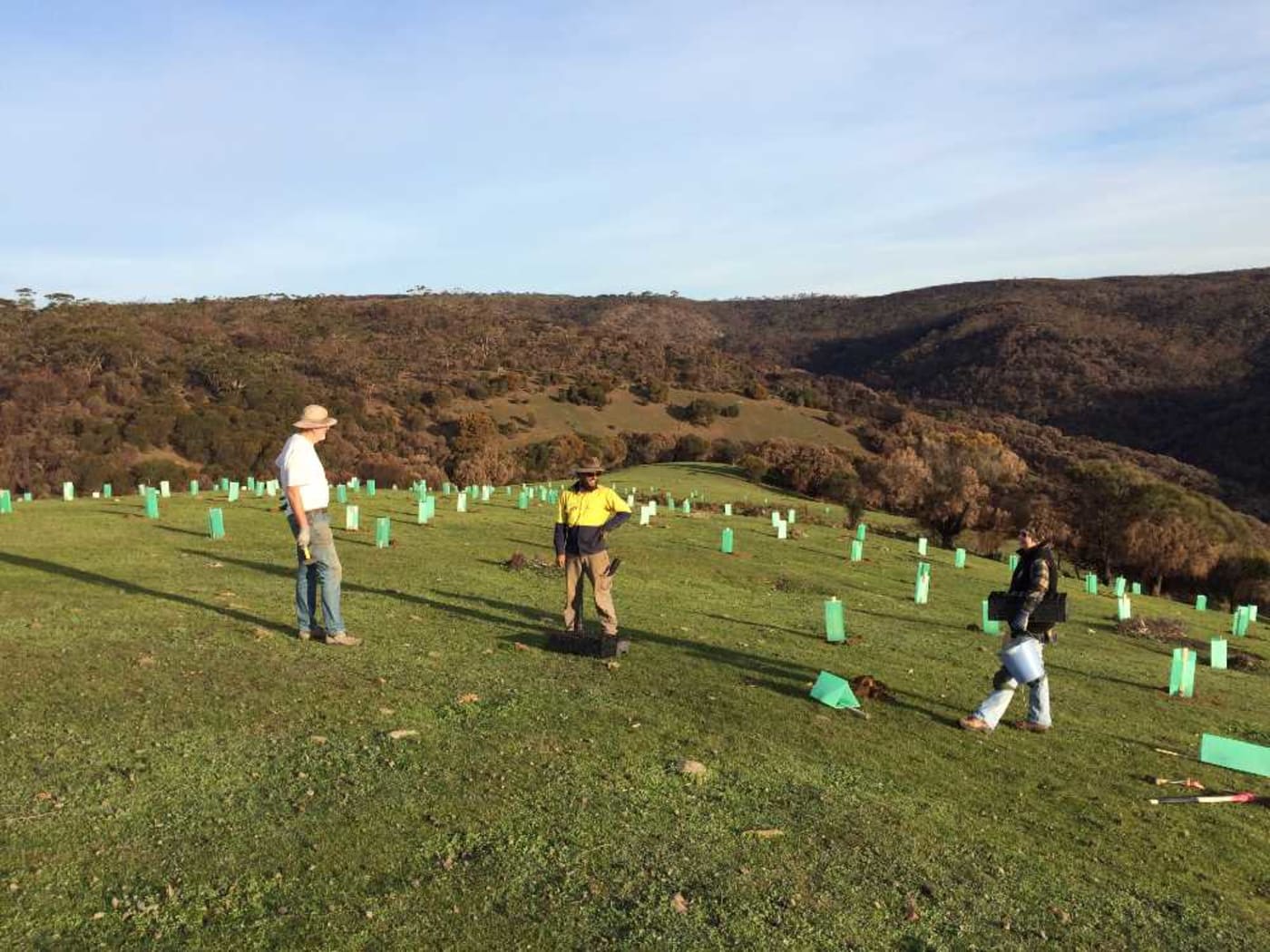 Landholders with KI Landscape staff member= Torran Welz= at a Middle River planting site