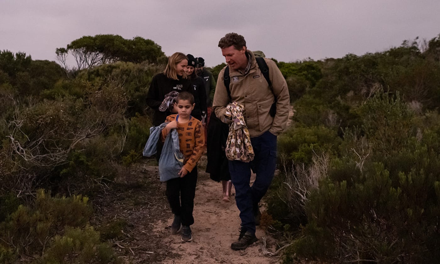 WWF-Australia's Rob Brewster and Narungga Elder Cyril Kartinyeri’s nephew travel on foot to the bettong release site on Guuranda (Yorke Peninsula)