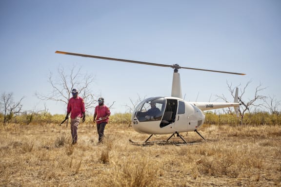Nyaliga Rangers arrive by helicopter on Wilinggin Country (Left to right: Nyaliga Rangers Clayton Victor and Silas Purcell.