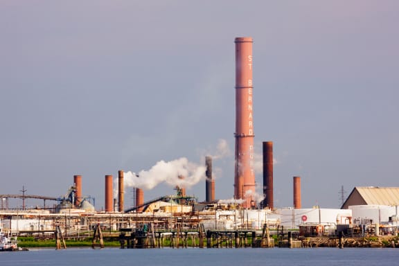 Industrial factory on waterfront, New Orleans, Louisiana, United States. Mississippi River