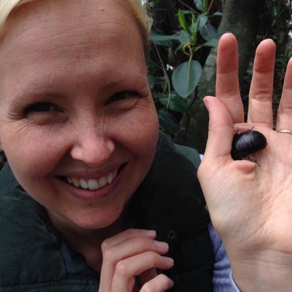 WWF-Australia Chief Conservation Officer Rachel Lowry holding an endangered Lord Howe Island Wood Feeding Cockroach