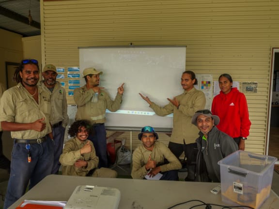 Excited Djabugay Bulmba Rangers moments after seeing an image of a platypus. They had 400,000 images to check but found the platypus image within the first hour