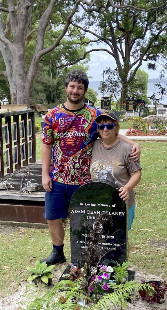 Djarra and his beloved Nanna at his father’s gravesite on Minjerribah (supplied)