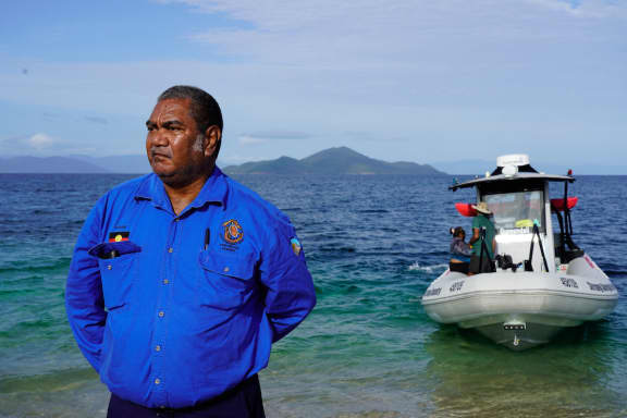 Uncle Eddie Smallwood ( Gudjuda Reference Group Aboriginal Corporation) on the beach at Brook Islands National Park= part of the Great Barrier Reef World Heritage Area