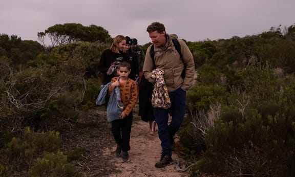 WWF-Australia's Rob Brewster and Narungga Elder Cyril Kartinyeri’s nephew travel on foot to the bettong release site on Guuranda (Yorke Peninsula)