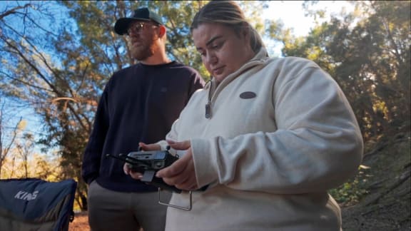 Quandamooka Yoolooburrabee Aboriginal Corporation (QYAC)'s Kiah Morgan operating drone during koala survey on Stradbroke Island in collaboration with Kenneth Geipel from Robotto (Denmark)