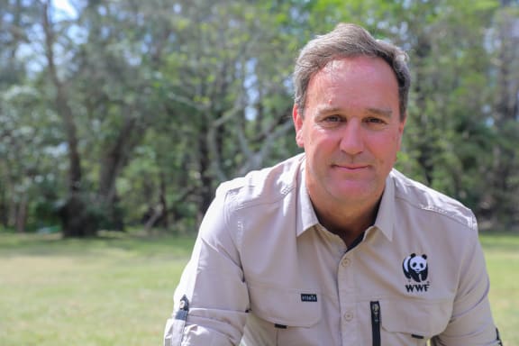 Dermot O'Gorman sets up sensor camera to detect eastern quolls in Booderee National Park.
