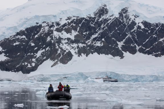 WWF's Chris Johnson flying a drone from a zodiac in waters of the Antarctic Peninsula in March 2024.