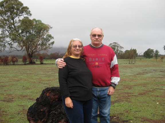 WWF-Australia bequestors Frank and Jenny in front of the Grampians partly covered by low fog.