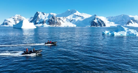 The team uses small Zodiac boats deployed from a ship to search for and study whales in one of the most spectacular and remote regions on earth.