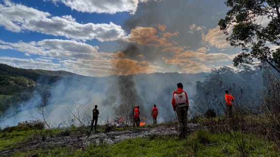 Githabul Rangers extinguishing Cultural Burn on Githabul Country