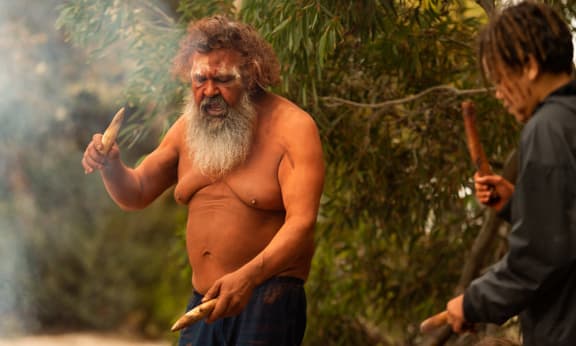 Narungga Elder Quenten Agius performs a traditional smoking ceremony for the return of the brush-tailed bettongs