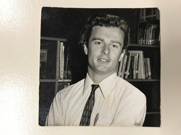 A young David Waterhouse smiles in an old, sepia printed photo.