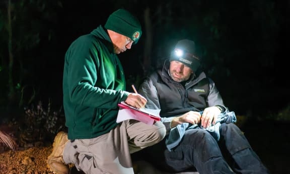 Aaron Smith and Derek Sandow trap bettongs in Manjimup= WA