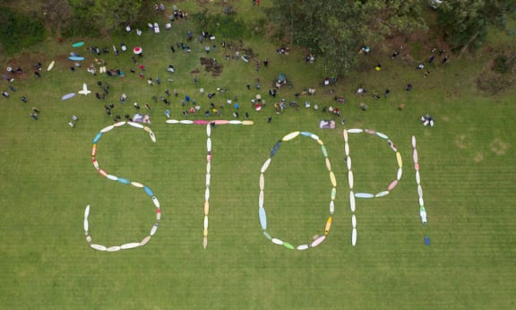Manyana Matters aerial of STOP sign during protest