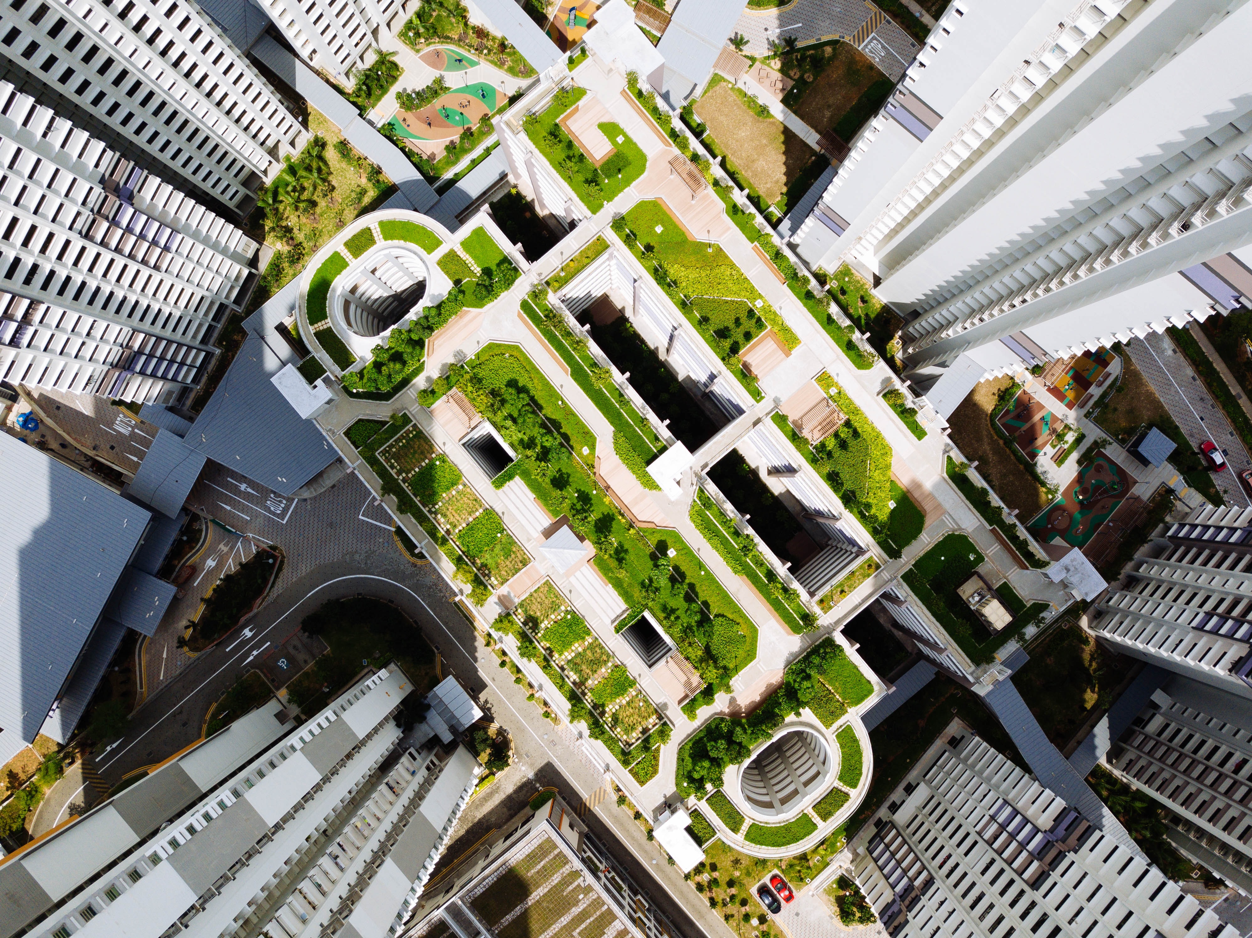 aerial view of city buildings with urban garden
