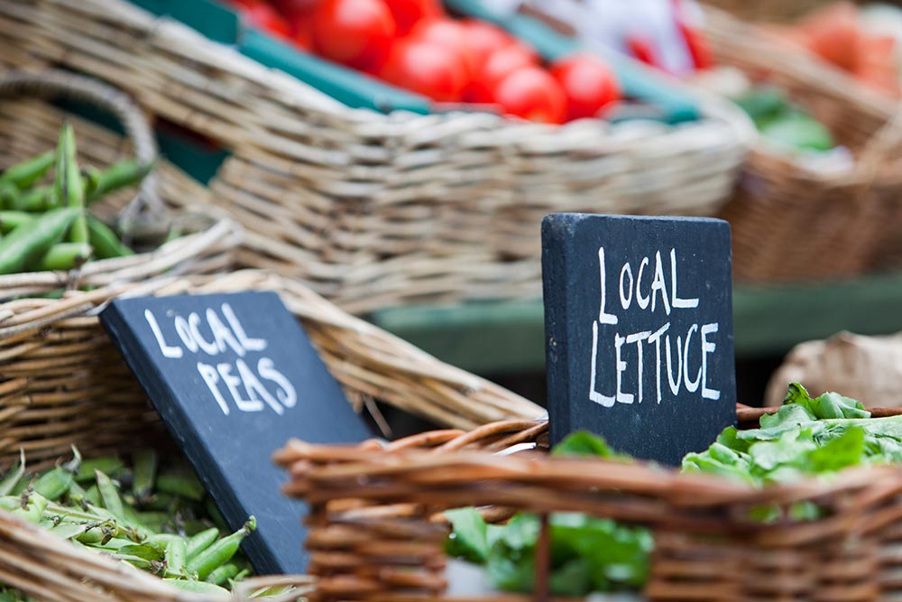 Local food (market) for sale at a shop in Cley Next the Sea, Norfolk, UK. Buying local produce helps to cut down massively on food miles.