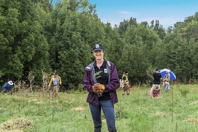 WWF-Australia's Tanya Pritchard holding a sapling during a koala tree planting event with Bangalow Koalas